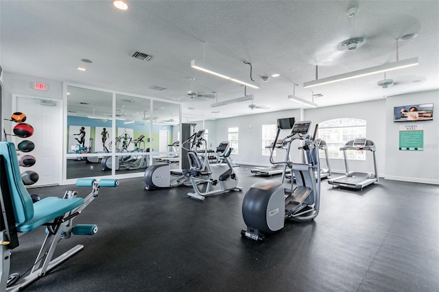 4618 Deep Creek Ter, Parrish, FL 34219 - gym with ceiling fan and a textured ceiling
