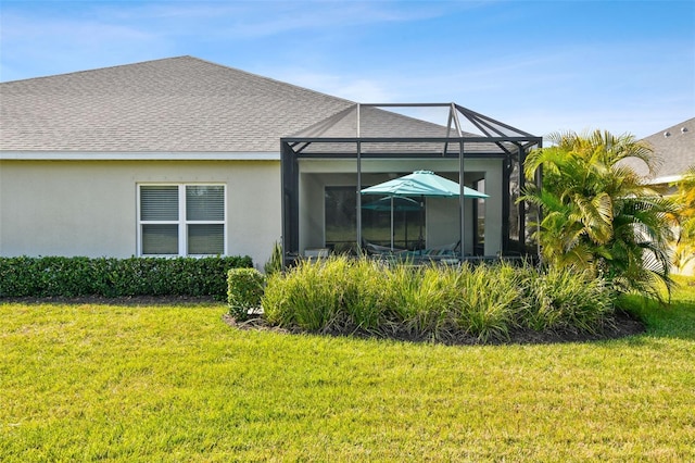 4618 Deep Creek Ter, Parrish, FL 34219 - rear view of house with glass enclosure and a yard