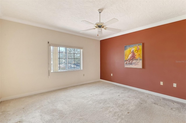 unfurnished room with light colored carpet, ceiling fan, a textured ceiling, and crown molding