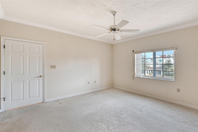 carpeted empty room with crown molding, a textured ceiling, and ceiling fan