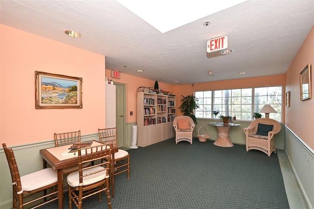 interior space featuring dark colored carpet