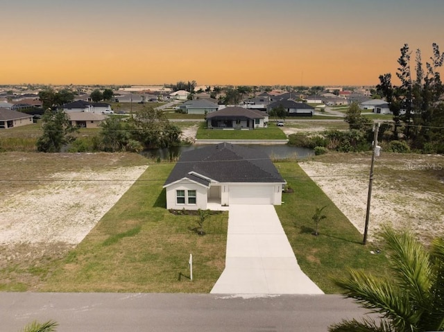 exterior space with a yard and a garage