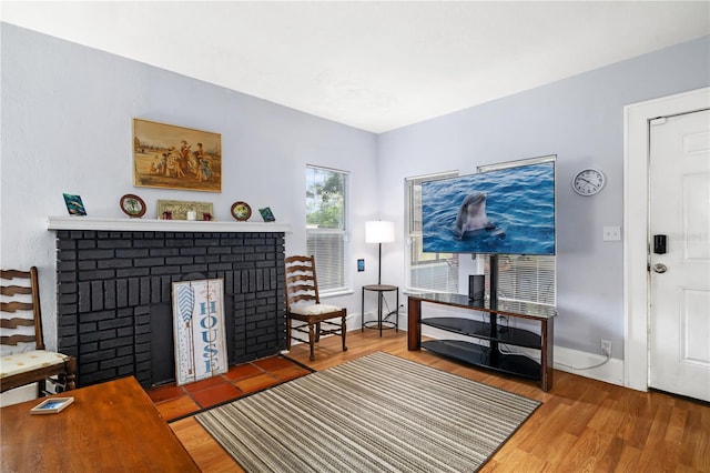 interior space featuring hardwood / wood-style floors and a fireplace