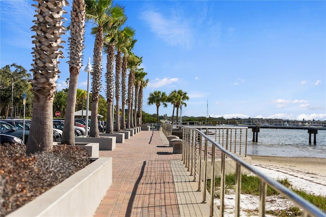 exterior space featuring a water view and a boat dock