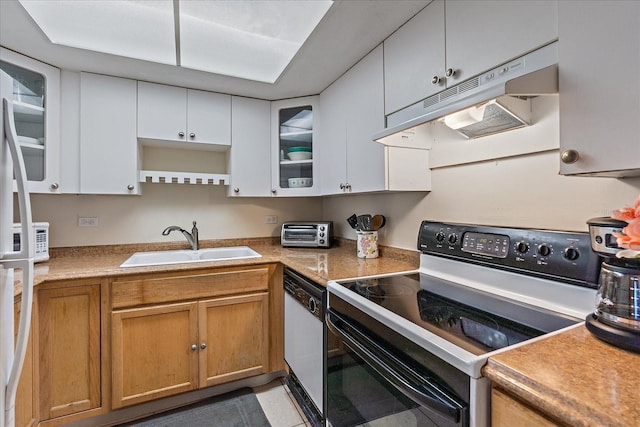 kitchen featuring white dishwasher, light tile floors, range with electric stovetop, white cabinets, and sink