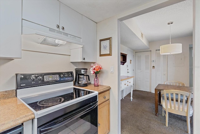 kitchen featuring electric stove, decorative light fixtures, white cabinets, and dark colored carpet