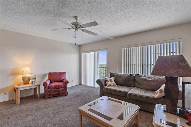 carpeted living room with a textured ceiling and ceiling fan