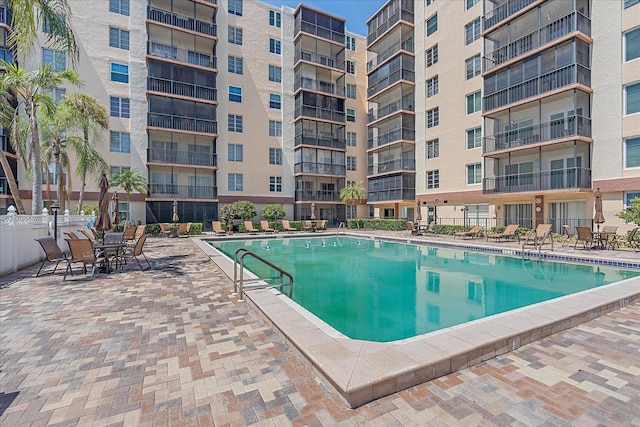 view of swimming pool with a patio