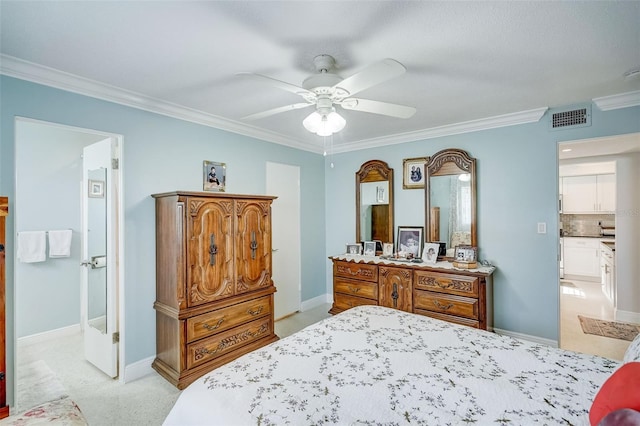 carpeted bedroom featuring crown molding, ensuite bathroom, and ceiling fan