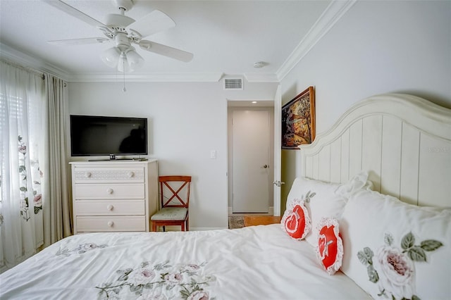 bedroom featuring ornamental molding, hardwood / wood-style flooring, and ceiling fan