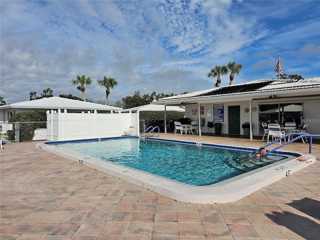 view of pool featuring a patio