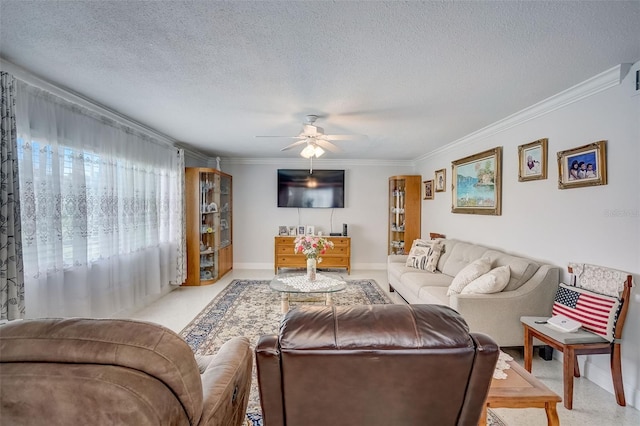 living room featuring light colored carpet, a textured ceiling, ornamental molding, and ceiling fan