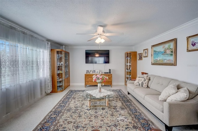 living room with ceiling fan, crown molding, and a textured ceiling