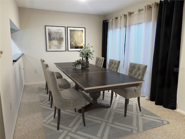 view of carpeted dining area