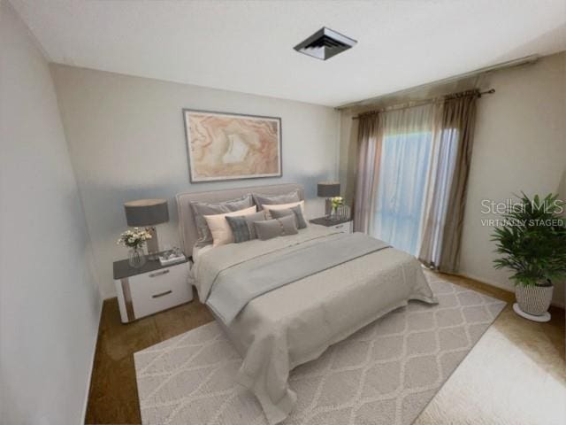 bedroom featuring light colored carpet