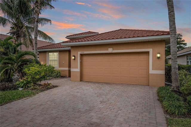 mediterranean / spanish-style house featuring a garage