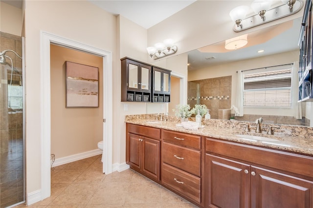 bathroom with tile patterned floors, vanity, and toilet