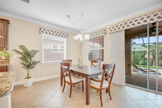 dining area featuring light tile patterned flooring, a healthy amount of sunlight, and ornamental molding