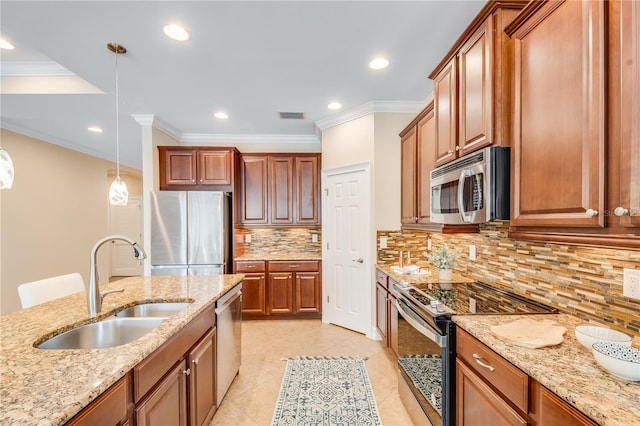 kitchen featuring appliances with stainless steel finishes, backsplash, light stone counters, sink, and pendant lighting