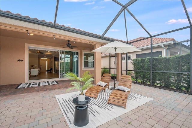 view of patio / terrace with glass enclosure and ceiling fan