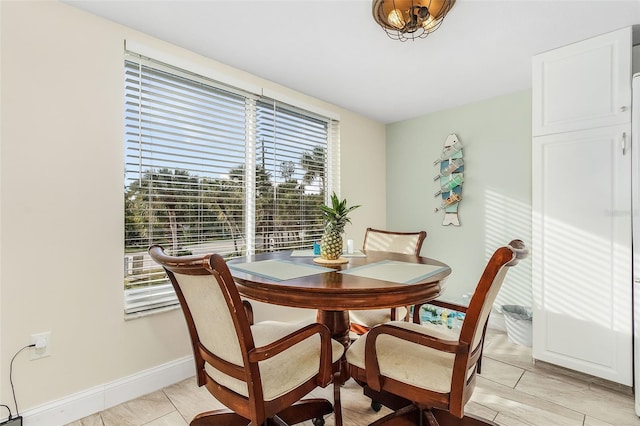 dining room featuring light tile floors