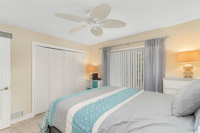 tiled bedroom featuring a closet and ceiling fan