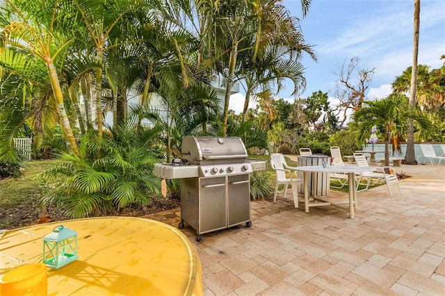 view of patio featuring a grill