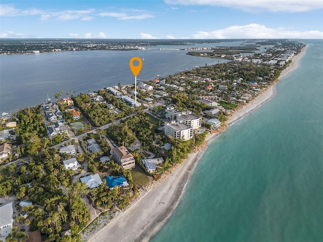 birds eye view of property featuring a water view and a view of the beach