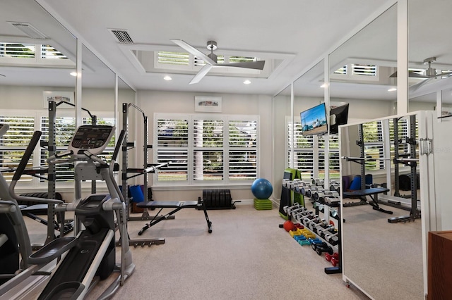 exercise room with a wealth of natural light and ceiling fan