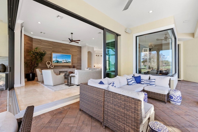 view of patio featuring an outdoor living space, area for grilling, and ceiling fan