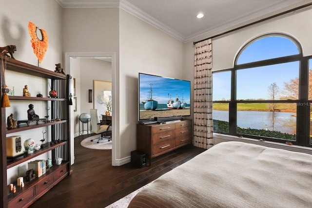 bedroom with crown molding and dark wood-type flooring