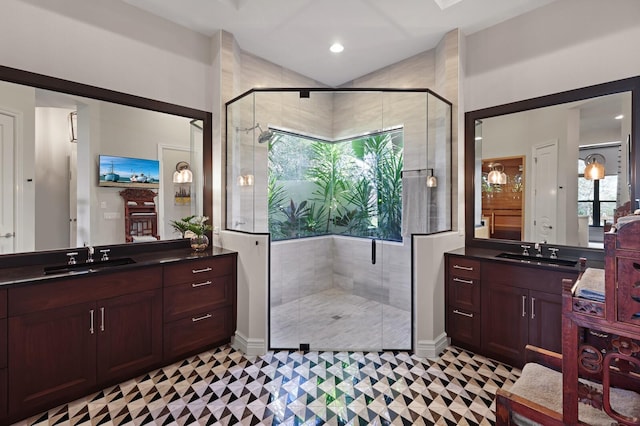 bathroom with vanity and a shower with shower door