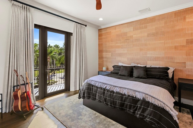 bedroom featuring access to exterior, crown molding, hardwood / wood-style floors, and ceiling fan