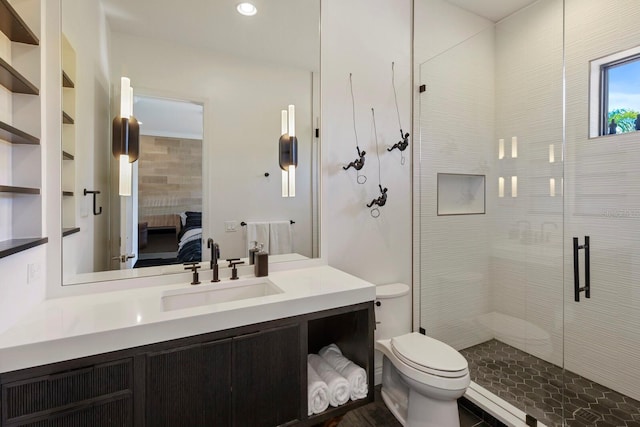 bathroom featuring walk in shower, vanity, and toilet