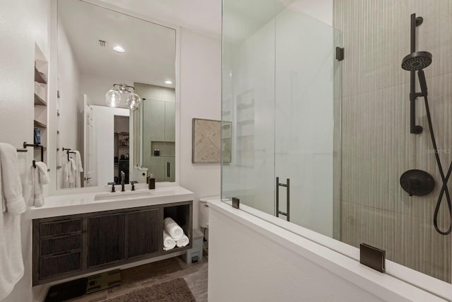 bathroom with vanity and an enclosed shower