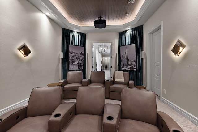 home theater room with a notable chandelier, a tray ceiling, carpet floors, and wooden ceiling