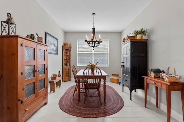 dining area with a notable chandelier and light tile patterned floors