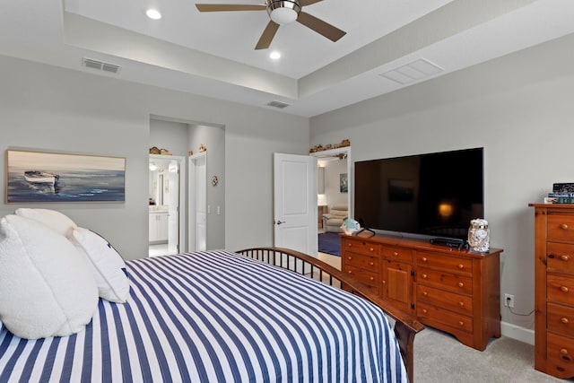 carpeted bedroom featuring ensuite bath and ceiling fan