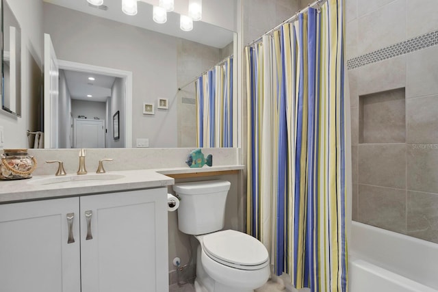 full bathroom featuring shower / bath combination with curtain, vanity, and toilet