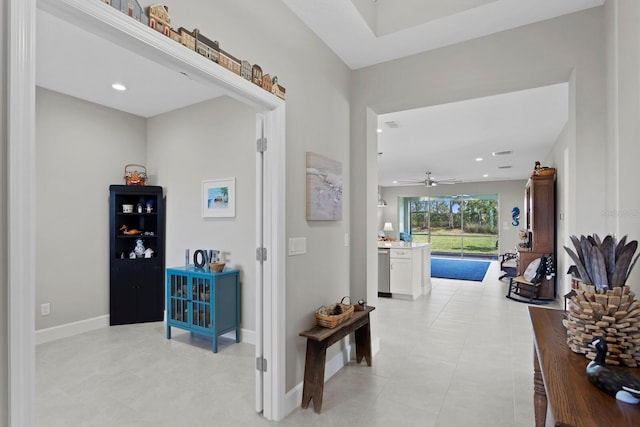 hallway with light tile patterned floors