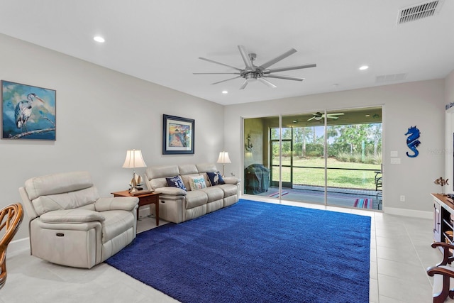 living room with ceiling fan and light tile patterned flooring