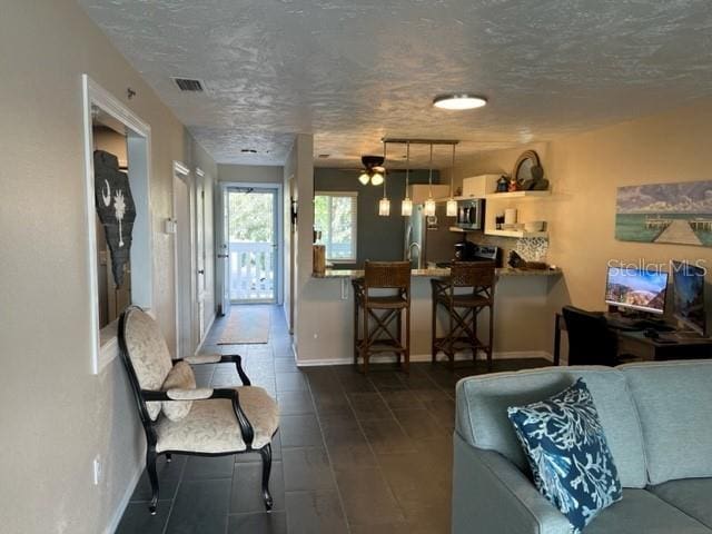 living room featuring a textured ceiling