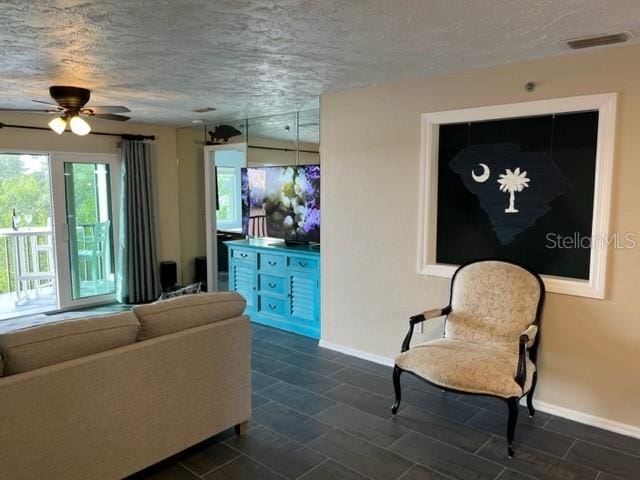 living room featuring a textured ceiling