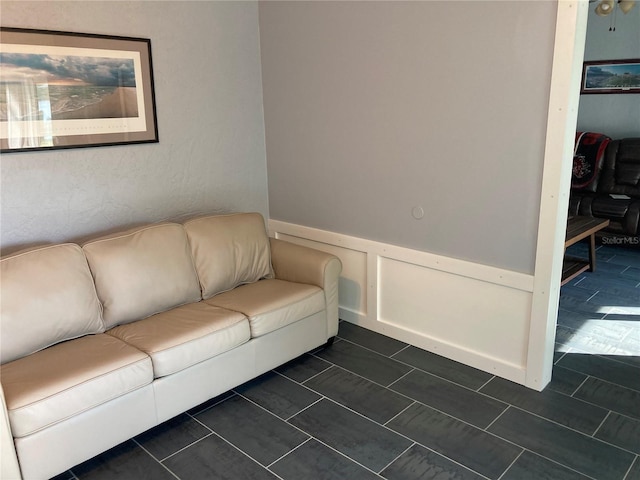 unfurnished living room featuring dark tile patterned floors