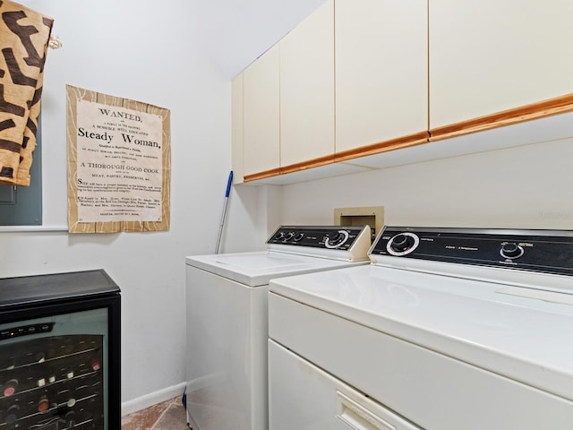 laundry area with washing machine and dryer, cabinets, wine cooler, and washer hookup