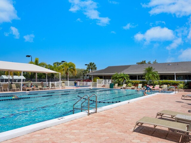 view of swimming pool with a patio