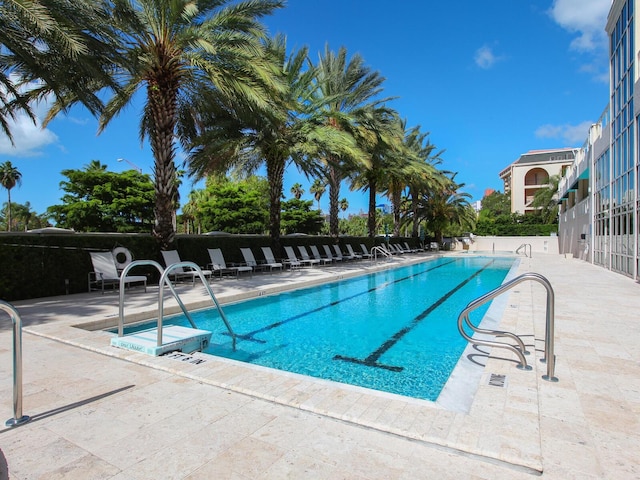 view of swimming pool featuring a patio area