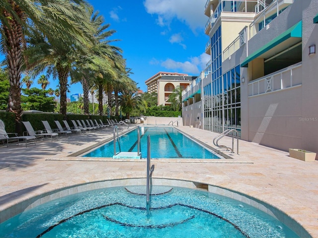 view of swimming pool featuring a patio