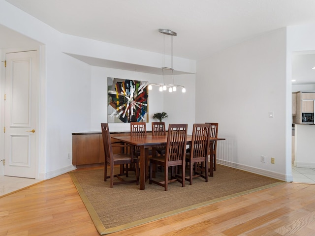 dining room with hardwood / wood-style floors