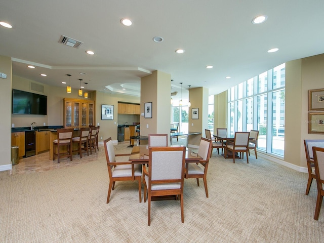 dining room with light carpet